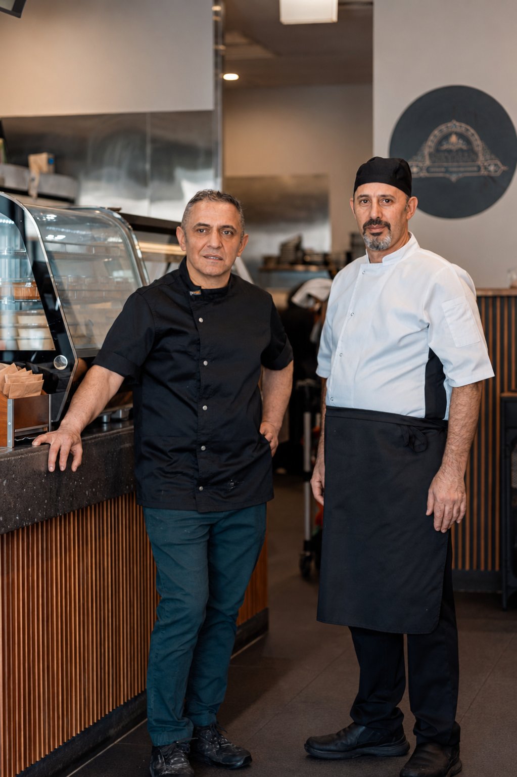 Rashid and Jalil, the team behind Reyhan Persian & Turkish Cuisine, at the counter of their Weston ACT restaurant